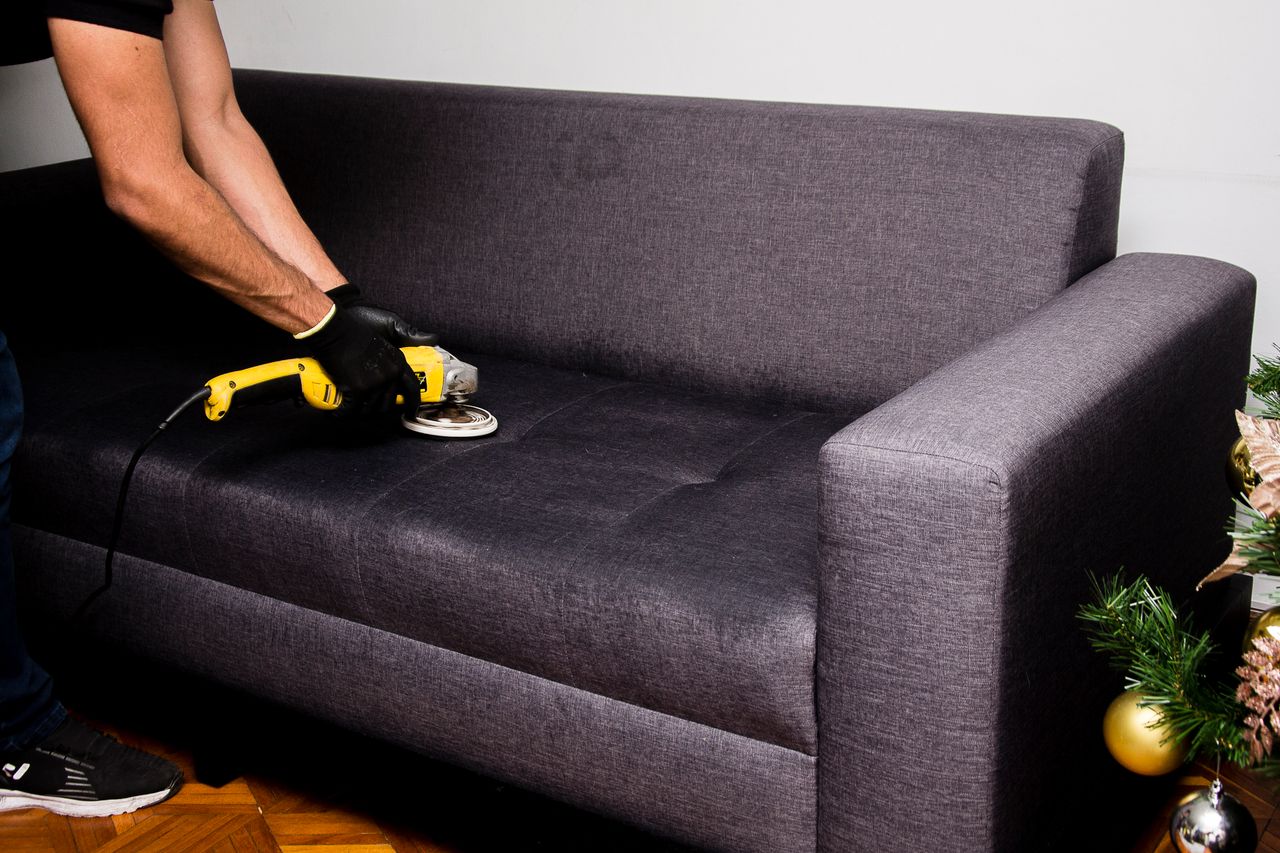 Crafting Captivating Headlines: Your awesome post title goes here A professional performs sofa cleaning with a grinder in an indoor setting, showcasing efficient service.